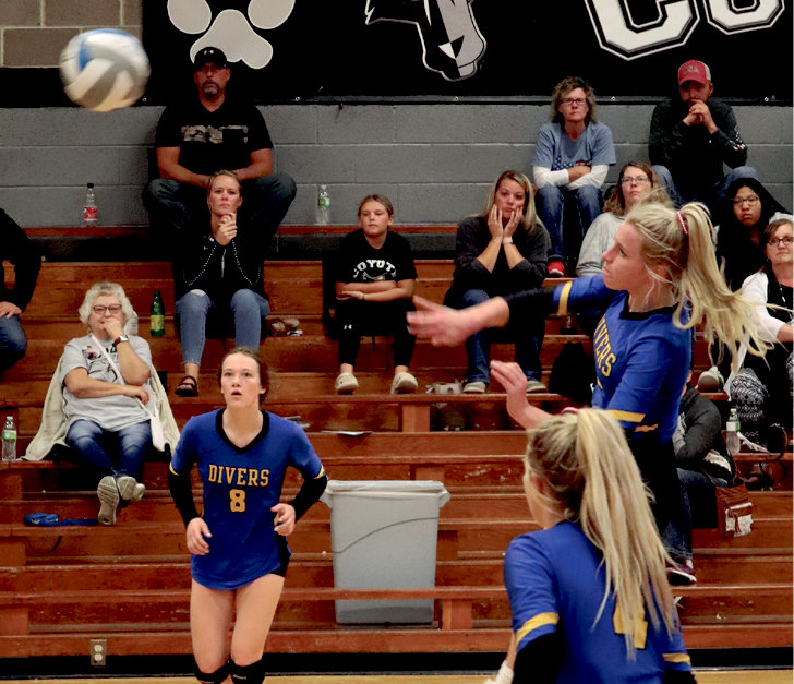 Annika Nelson with the block (first photo) along with Jocelyn Steffensen and Ava Malone (second photo) and the rest of the Lady Divers defeated Waverly-South Shore in three sets on Mon, Sep 20.