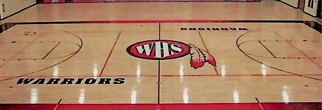 Details remain to be worked out, but Marv McCune's name would be placed on De Smet's basketball court, similar to the word 'Warriors' shown in this example.
