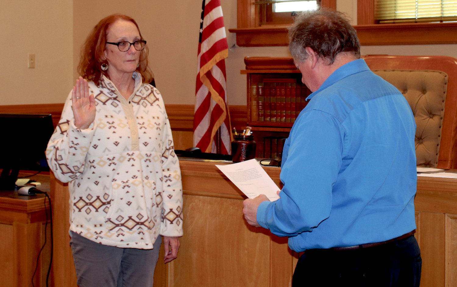 Echo Steffensen, left, was appointed by Kingsbury County Commissioners to replace the County Auditor, Jennifer Barnard. At 3 p.m. Friday, Steffensen took the oath of office before Kingsbury County State's Attorney Gary Schumacher and some of her fellow county employees.