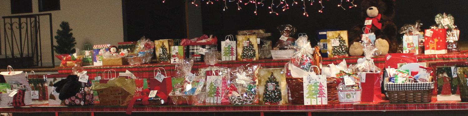 Merchants in De Smet donated Christmas baskets filled with goods or services available locally. Thirty-three baskets had been donated. Visitors bought tickets, put their name and phone number on them and then placed the tickets in the appropriate bag for the basket desired.