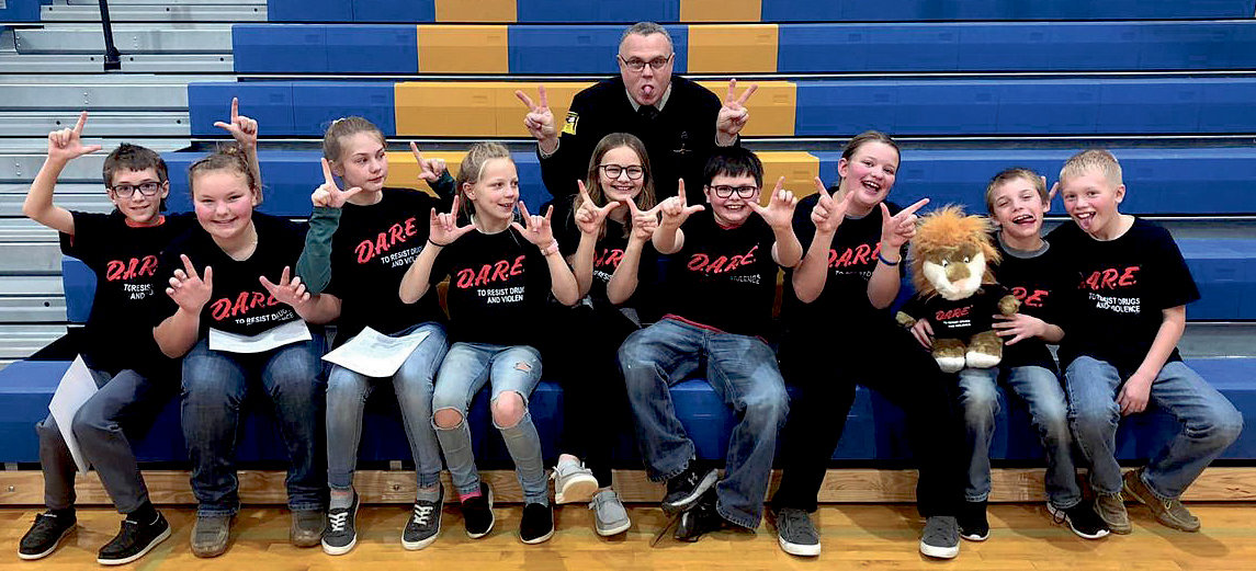 Lake Preston fifth-graders graduated Dec. 22 from the Drug Abuse Resistance and Education (DARE) program taught by Kingsbury County Deputy Mike Jenkins. Jenkins, rear, poses for a fun shot with the students. Participants include Case Carlson, left, Bentlee Holt, Allie Curd, Kayla Rhoades, Emily Odegaard, Owen Paul, Kinley Root, Draycen Hoard and Nolan Eichler.