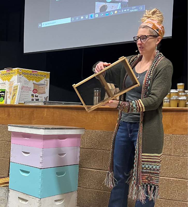 Beth Poppen showing one of the many items needed for the beehives to keep a healthy bee population.