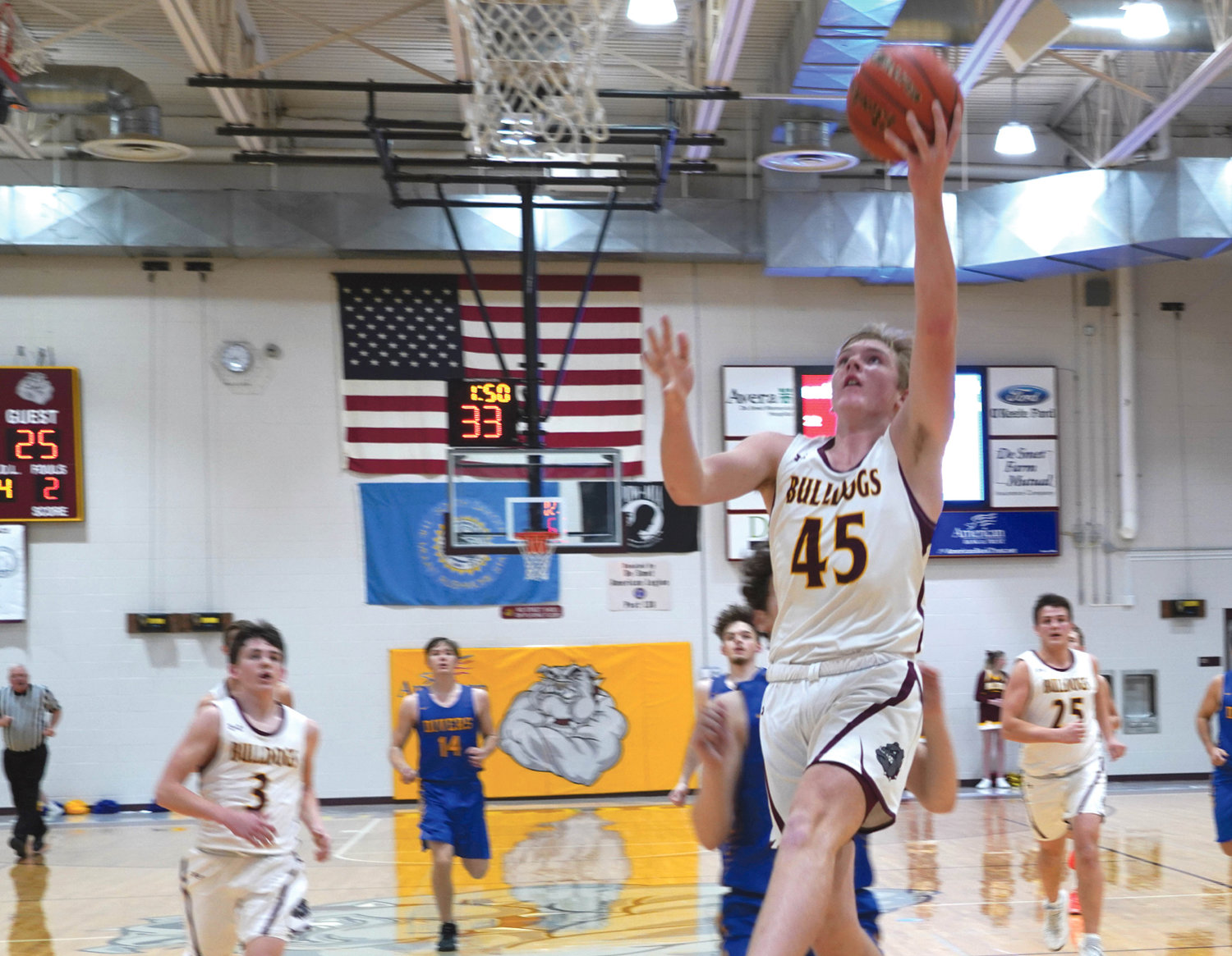 De Smet Bulldog Trace Van Regenmorter finishes a break-away layup for two points in Thursday night’s game in the Dog Pound. The Bulldogs had five players score double digits and won 88-25.