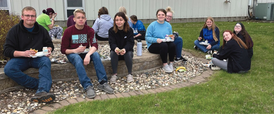 Iroquois students enjoy the warm weather during a picnic eating the donated beef from the Cattlemen’s Association.