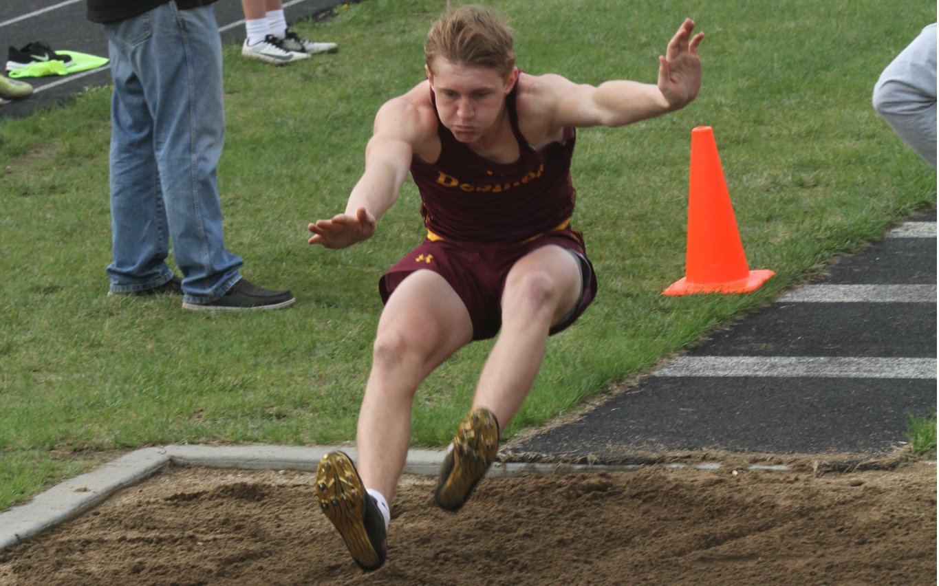 Kadyn Fast extends for extra distance in the long jump pit.