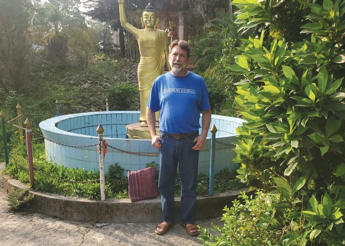 James Jesser, wearing his Kingsbury Journal shirt, stands in front of a Buddhist statue In Nepal.  Send us your picture wearing your Kingsbury Journal shirt! We'd love to see where these shirts get to be worn.