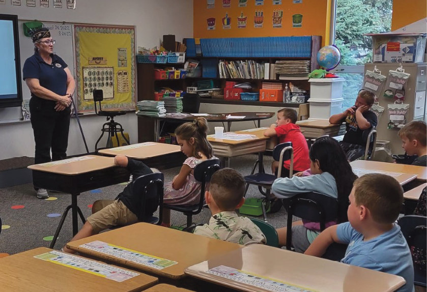 Annette Dunham, Americanism Officer with the Bensley-Rounds American Legion Post 280 of Iroquois, provided flag etiquette education to the fifth graders and information about the American flag to the first graders at the Iroquois School on August 24.