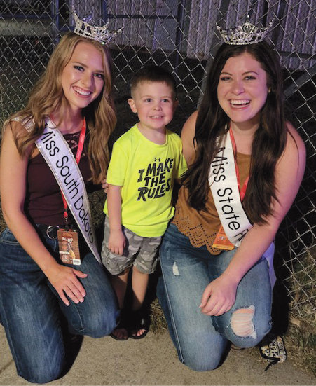 Three-year-old Landen Warner had the privilege of meeting 2022 Miss South Dakota Hunter Widvey, left, and 2022 Miss South Dakota State Fair Miranda O’Bryan, right, at the South Dakota State Fair. Both young women were so kind to him, and to say he was excited to meet “real life princesses” is an understatement.