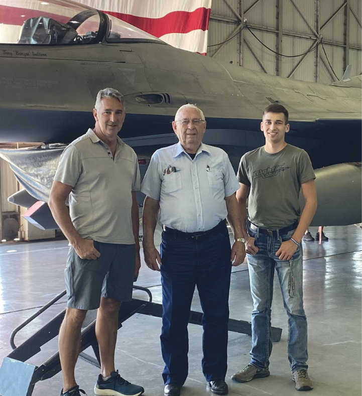 Hank Albrecht (center) flanked by his son and Honor Flight “guardian” Mike Albrecht (left) and his grandson Daniel Albrecht (right.)