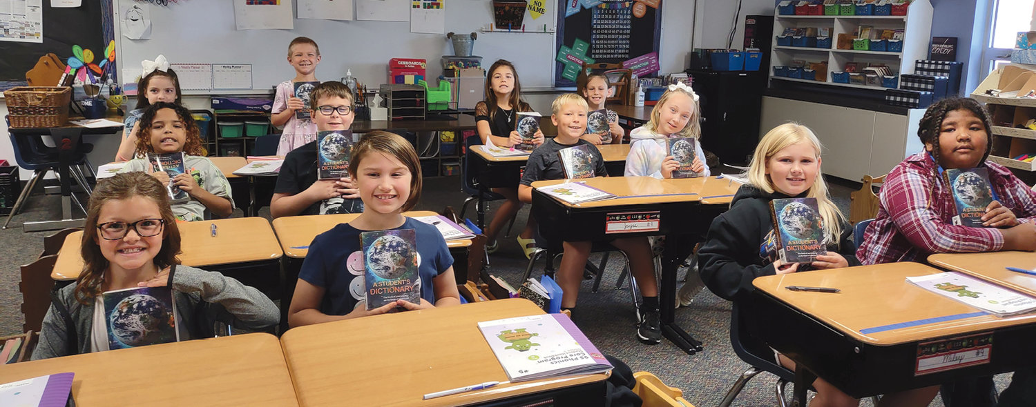 Third graders receiving dictionaries from the Iroquois American Legion include Abby Bechen, front left, Rachel Leinen, Miley Vincent, Lakaia Mallett; Qresiaanh Jones, middle left, Taten Meidinger, Jayce Geyer, Cassidy Lawton-Rose; Alisa Dunsworth, back left, Pieper Echtenkamp, Haven Thennis and Addison Williams. The Legion also presented the kindergarten class with stickers of the USA flag, second graders with rulers and fourth grade with graphic novels about the American flag.